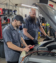 Tom's Auto Center - Ben Ben C. is Checking Vehicle at Tom’s Auto Center